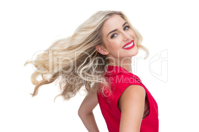 Smiling glamorous blonde posing