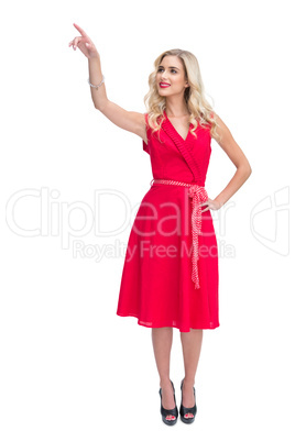 Beautiful woman pointing at something