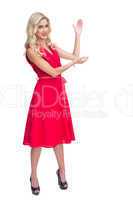 Woman wearing red dress presenting something