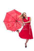 Beautiful woman wearing red dress holding umbrella