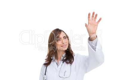 Brunette doctor reaching for something in the air