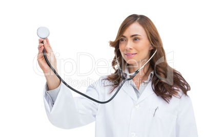 Smiling doctor holding stethoscope