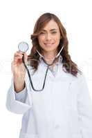 Smiling doctor holding stethoscope and looking at camera
