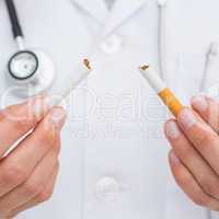 Close up on doctor breaking cigarette