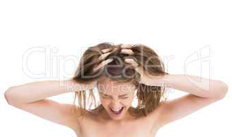 Bare girl with hands on head screaming