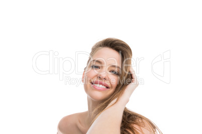 Bare natural woman smiling at camera