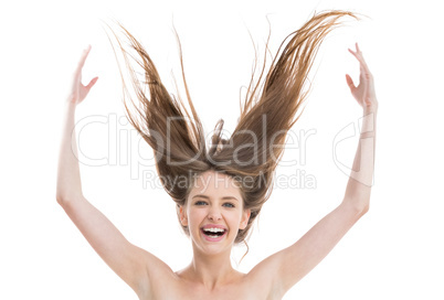 Laughing pretty woman throwing her hair up