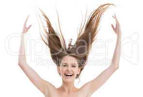 Laughing pretty woman throwing her hair up