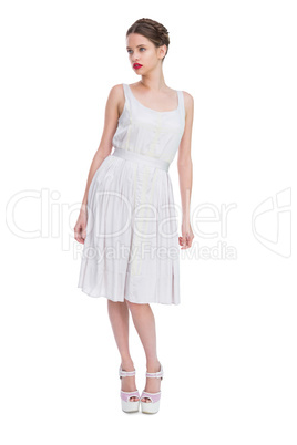 Beautiful woman in white dress posing