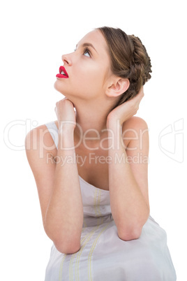 Beautiful woman sitting and looking up