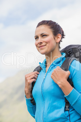 Smiling female hiker with backpack