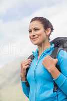 Smiling female hiker with backpack