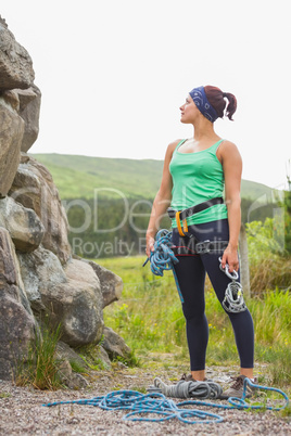 Attractive rock climber looking up at her challenge