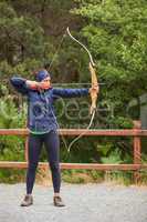 Brunette practicing archery
