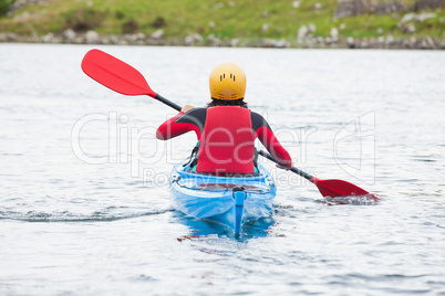 Woman rowing in a kayak