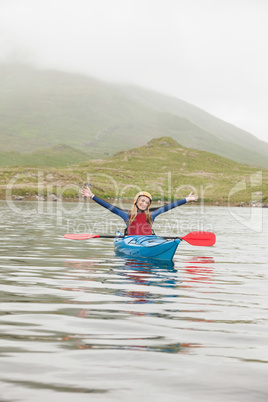 Blonde woman in a kayak