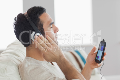 Content handsome man listening to music