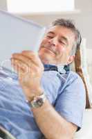 Happy man using a tablet pc