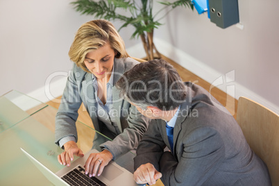 Business team going over work on the laptop