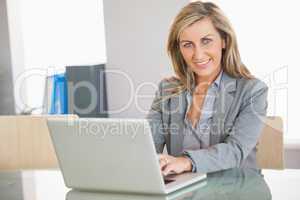 Businesswoman using a laptop in an office