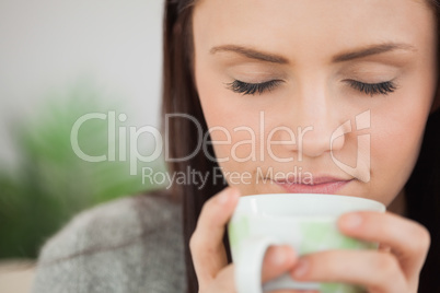 Girl holding a cup of coffee