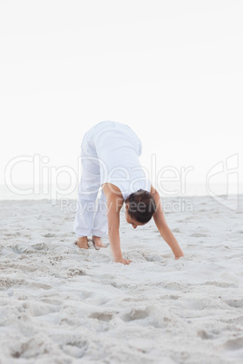 Woman in extended triangle yoga pose