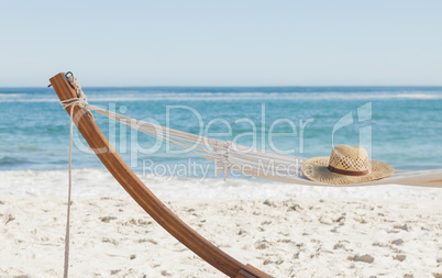 Shot of a straw hat lying on hammock