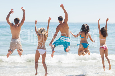 Group of friends having fun on the beach