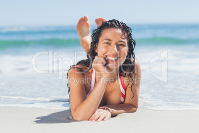 Woman lying down on beach