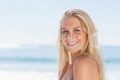 Close up view of blonde woman smiling at camera