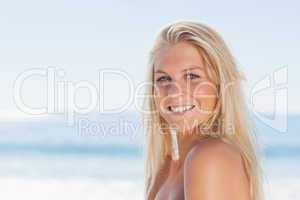 Close up view of blonde woman smiling at camera