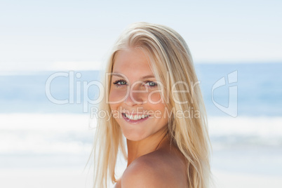 Close up view of blond woman smiling at camera