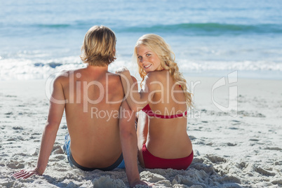 Rear view of couple on beach