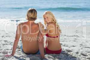 Rear view of couple on beach
