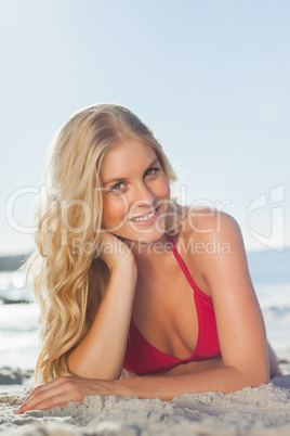 Beautiful woman lying down on the beach