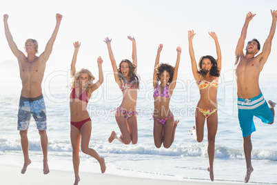 Group of friends having fun on the beach