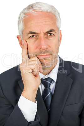 Pensive businessman looking at camera Pensive businessman looking at camera