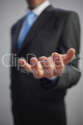 Close up of a stylish businessman reaching out