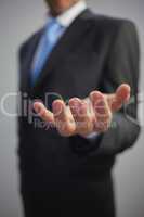 Close up of a stylish businessman reaching out