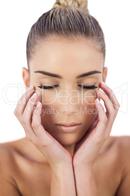 Concentrated woman holding her head and closing her eyes