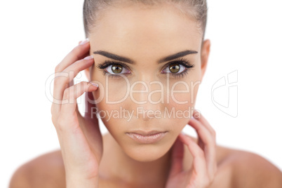 Close up of a serious woman looking at camera