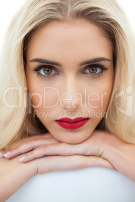 Close up of a serious blonde model looking at camera