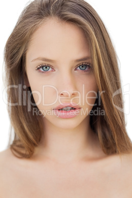 Unsmiling brunette model looking at camera