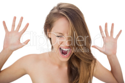 Yelling brunette model raising her hands