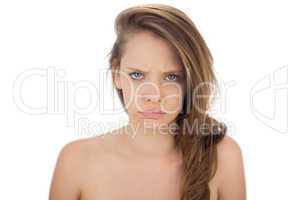 Frowning brunette model looking at camera