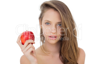 Attractive brunette model holding an apple