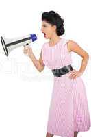 Angry black hair model shouting in a megaphone