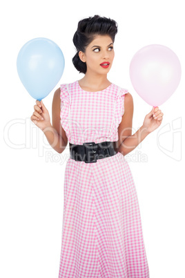 Thinking black hair model holding balloons