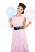 Cheerful black hair model holding balloons