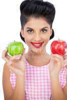 Happy black hair woman holding apples
